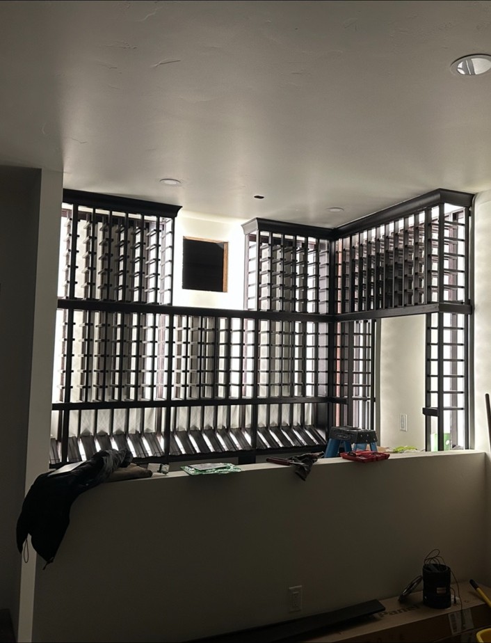 Wall-to-wall wine rack display with lighting